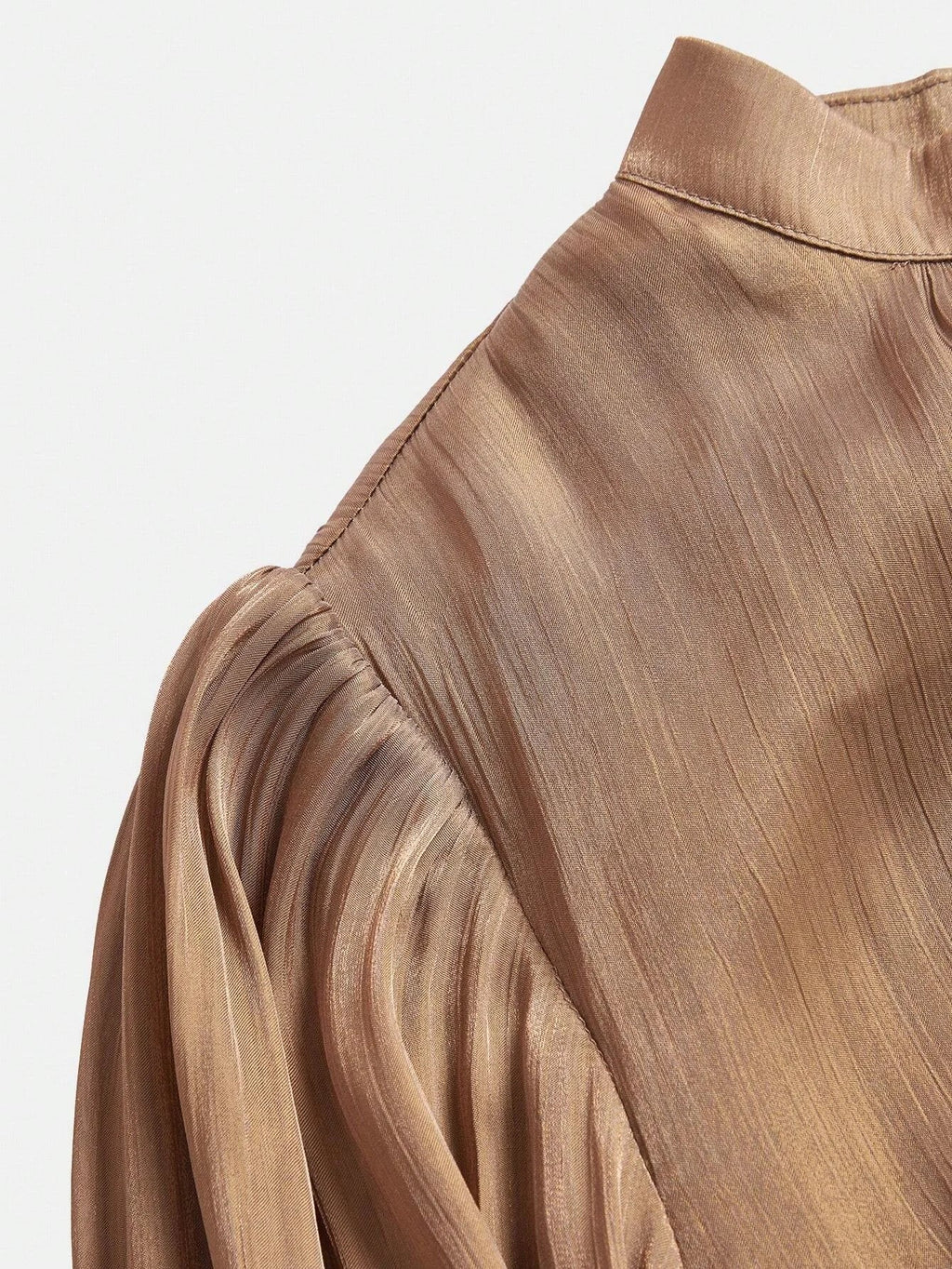 Elevate your wardrobe with this elegant taupe dress, featuring a sophisticated pleated design that drapes beautifully and.