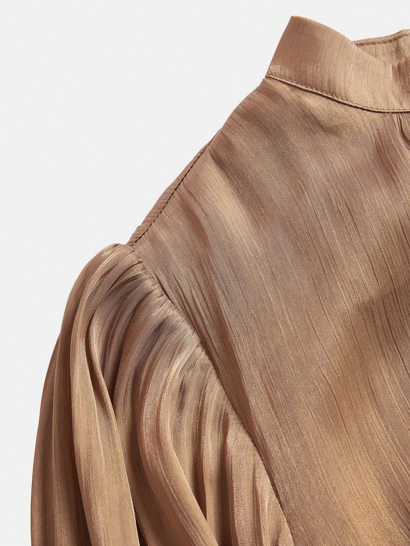 Elevate your wardrobe with this elegant taupe dress, featuring a sophisticated pleated design that drapes beautifully and.