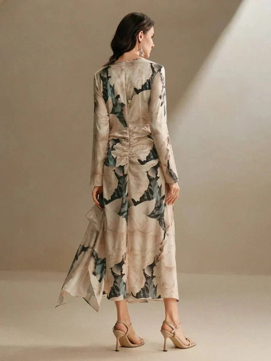 This elegant long-sleeve dress features a soft beige fabric adorned with pastel floral prints, creating a romantic and.