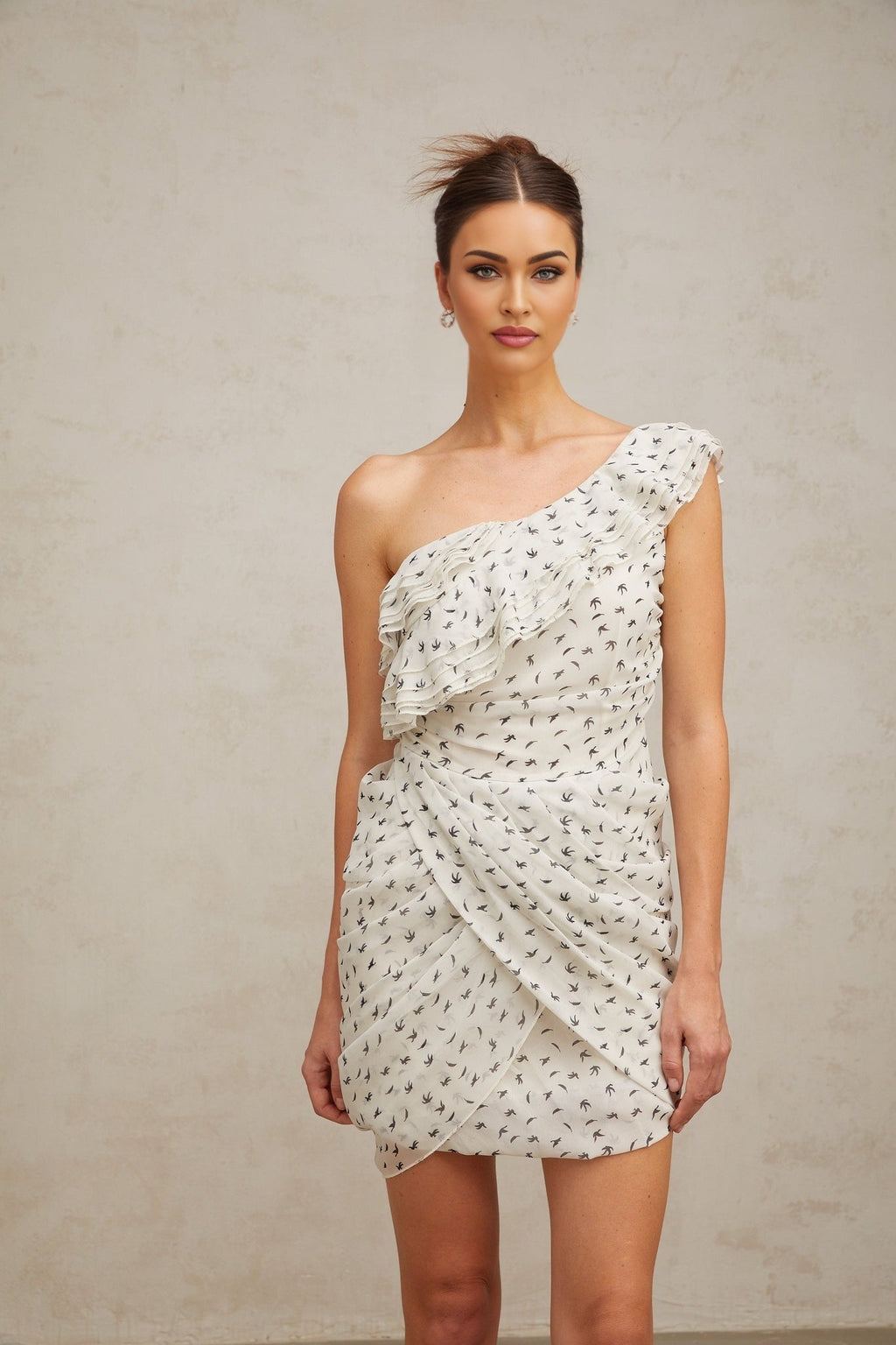 Angelina Mini Dress - One - shoulder design - Defined waistline - Stylish pattern - Delicate ruffled accents