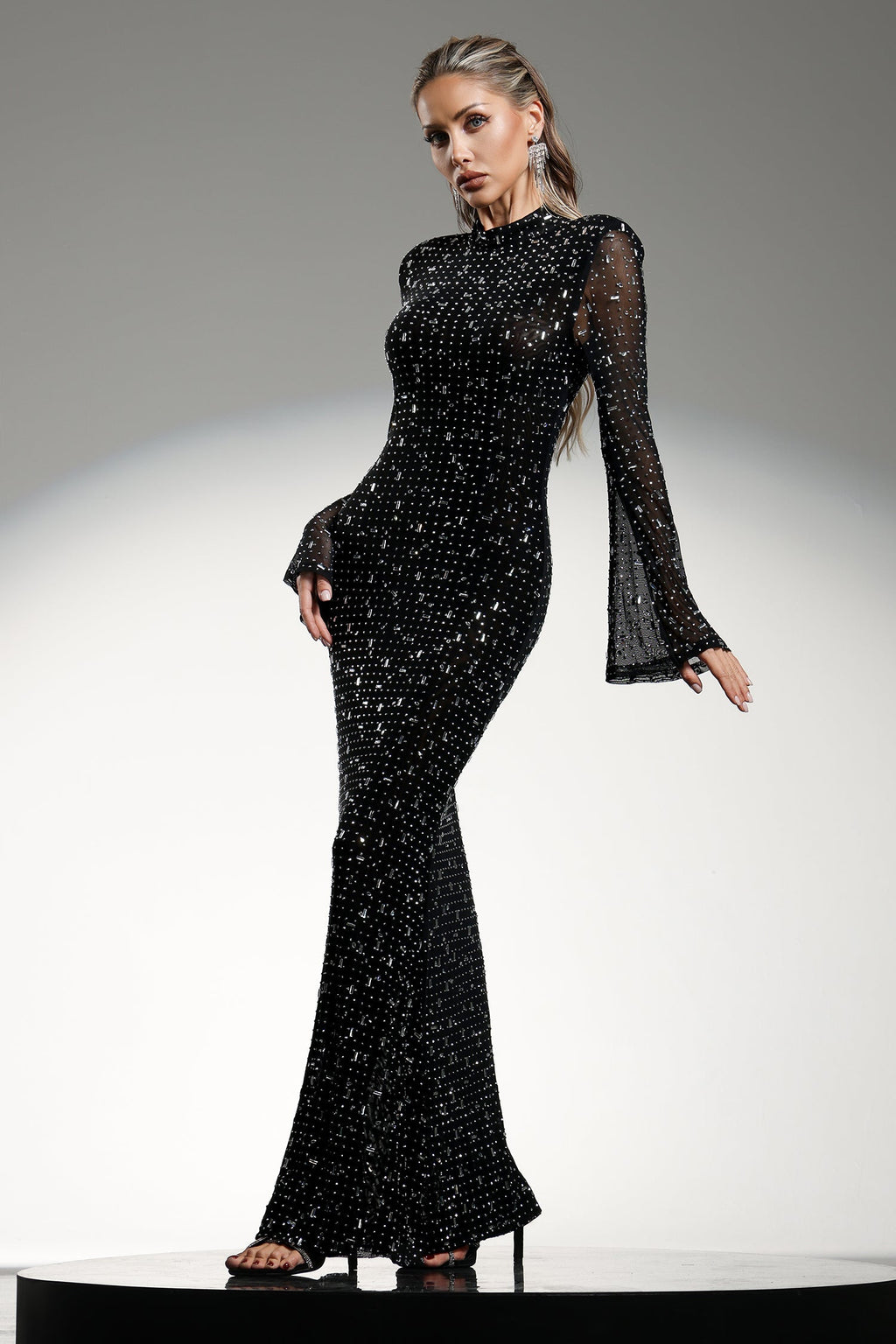Assunta Black Maxi Dress High Neckline Long Sleeves Diamond Detail Fitted Silhouette Flared Skirt Gala Wedding Formal Occasion