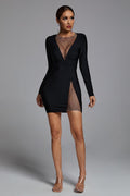 Black Esme Mesh Mini Dress with V neckline, long sleeves, and side slit for a chic and sophisticated look