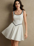 This charming white dress features a playful fit-and-flare silhouette, accentuated by a delicate black trim along the.