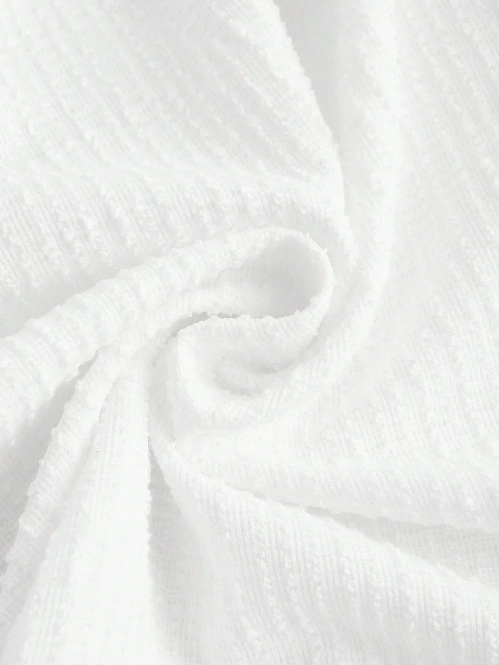 This elegant white dress features a soft, textured fabric that drapes beautifully for a flattering fit. Perfect for warm.
