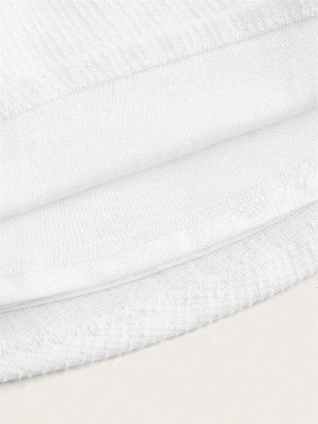 This elegant white dress features a soft, breathable fabric with a subtle texture that provides a luxurious feel. Its fitted.