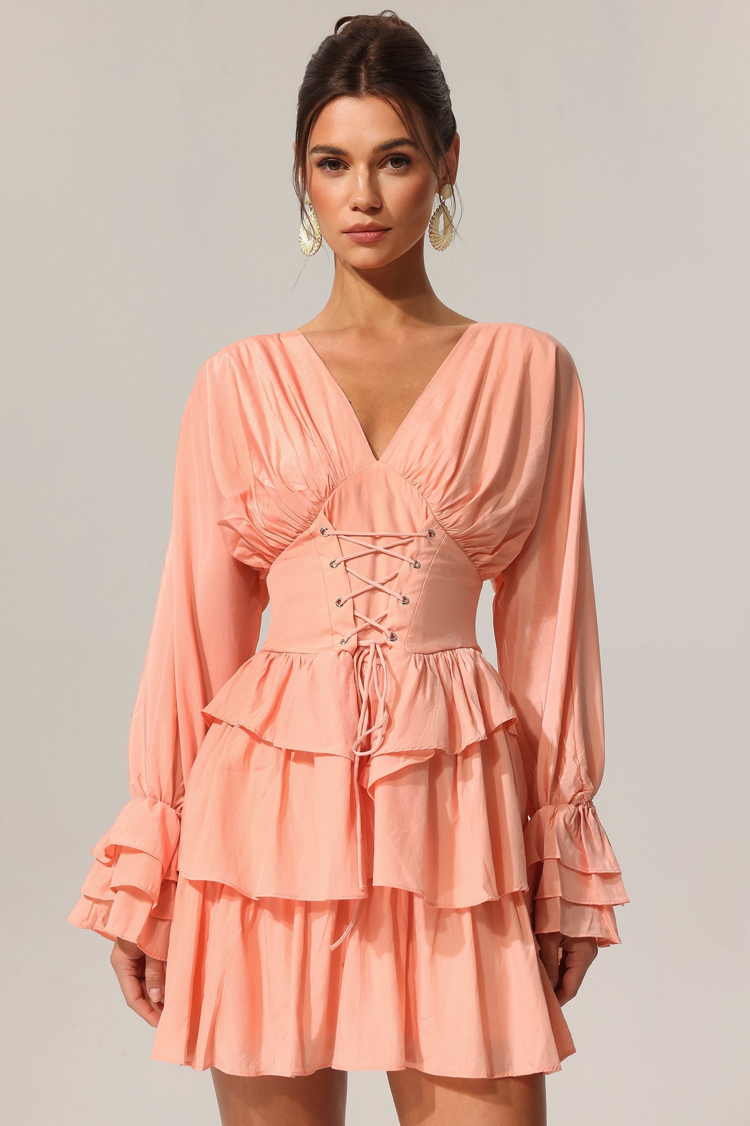 Charlotte Peach Flowing Silhouette V-Neckline Dress Lightweight Material Layered Folds Flared Sleeves Cinched Waist