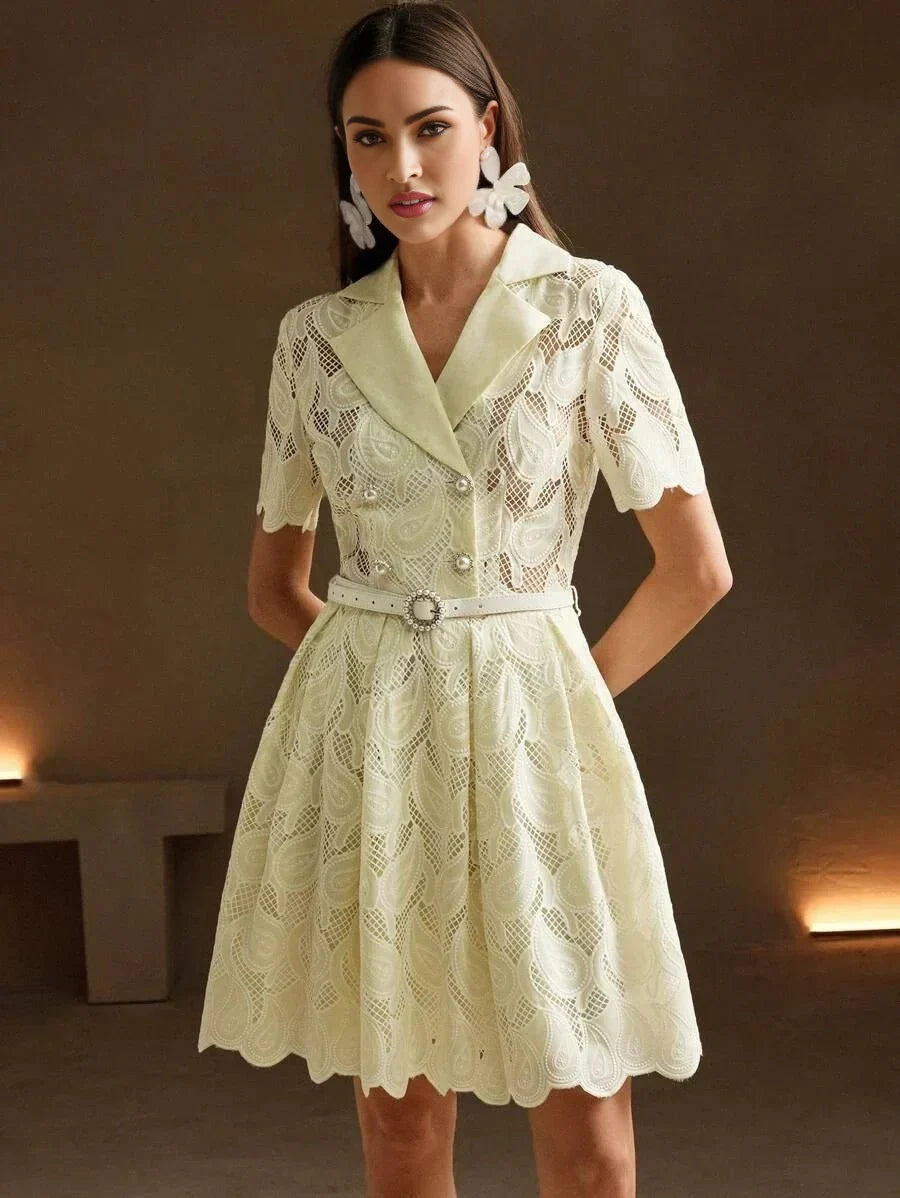 This charming light yellow dress features a delicate lace design with a fitted bodice and a flared skirt, exuding a playful.