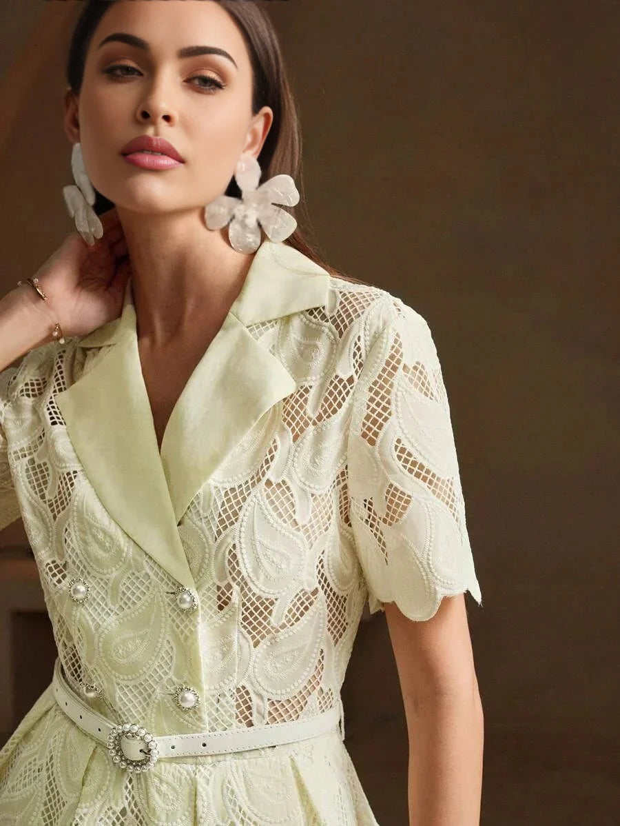 This elegant dress features a soft, pastel yellow hue with intricate lace detailing that adds a romantic touch. The fitted.