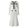 Dress - Fitted Silhouette With Flared Hem - Elegant Design With Pocket Detailing - Tailored Fit - Chic and Sophisticated Appearance
