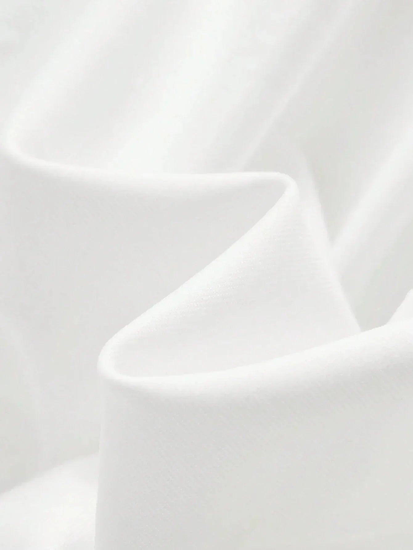 This stunning white dress features a soft, flowing fabric that drapes gracefully, creating an elegant and breathable fit.
