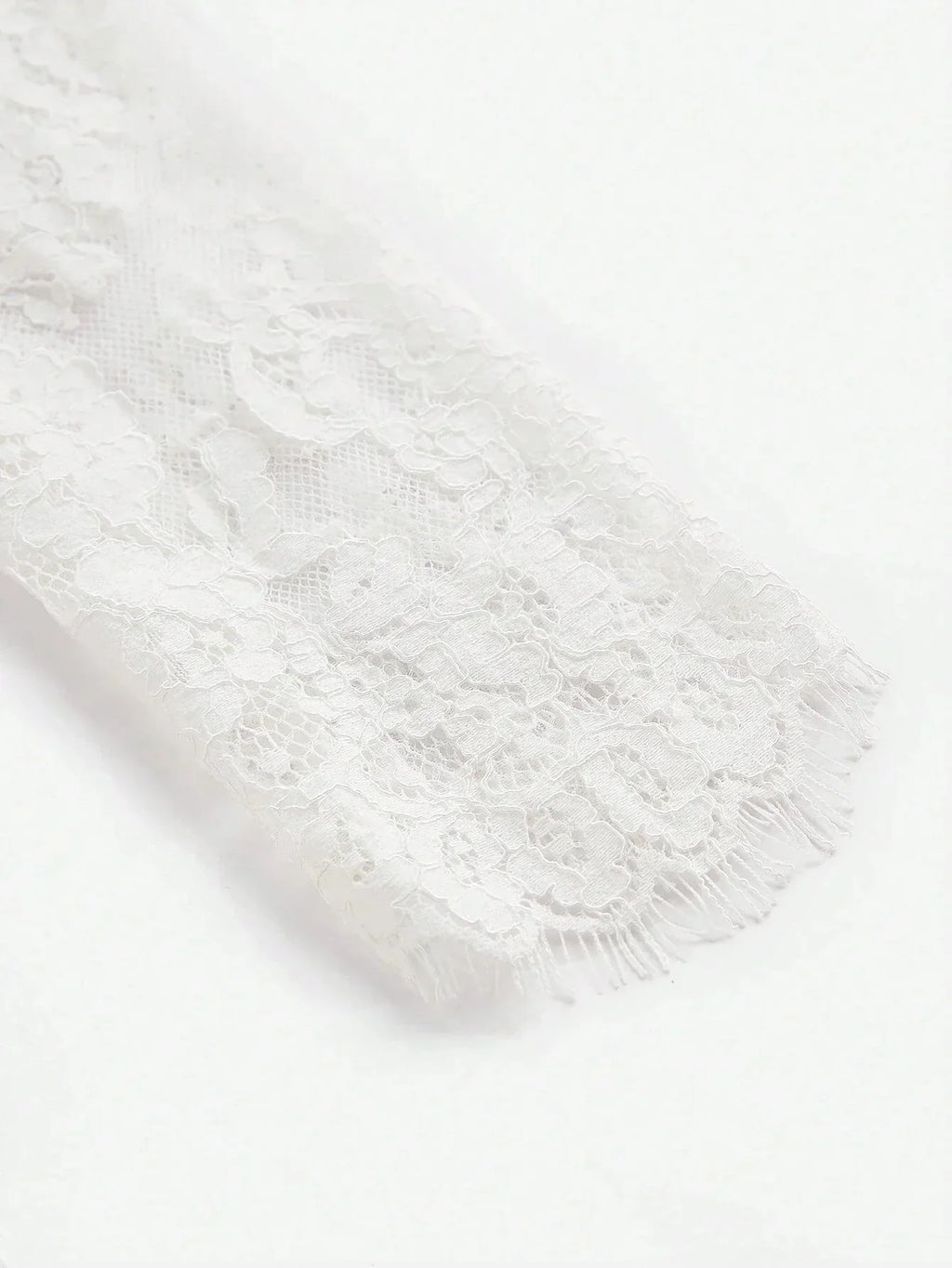 Delicate and romantic, this white lace dress features intricate floral patterns and a soft, flowing fit that adds elegance.