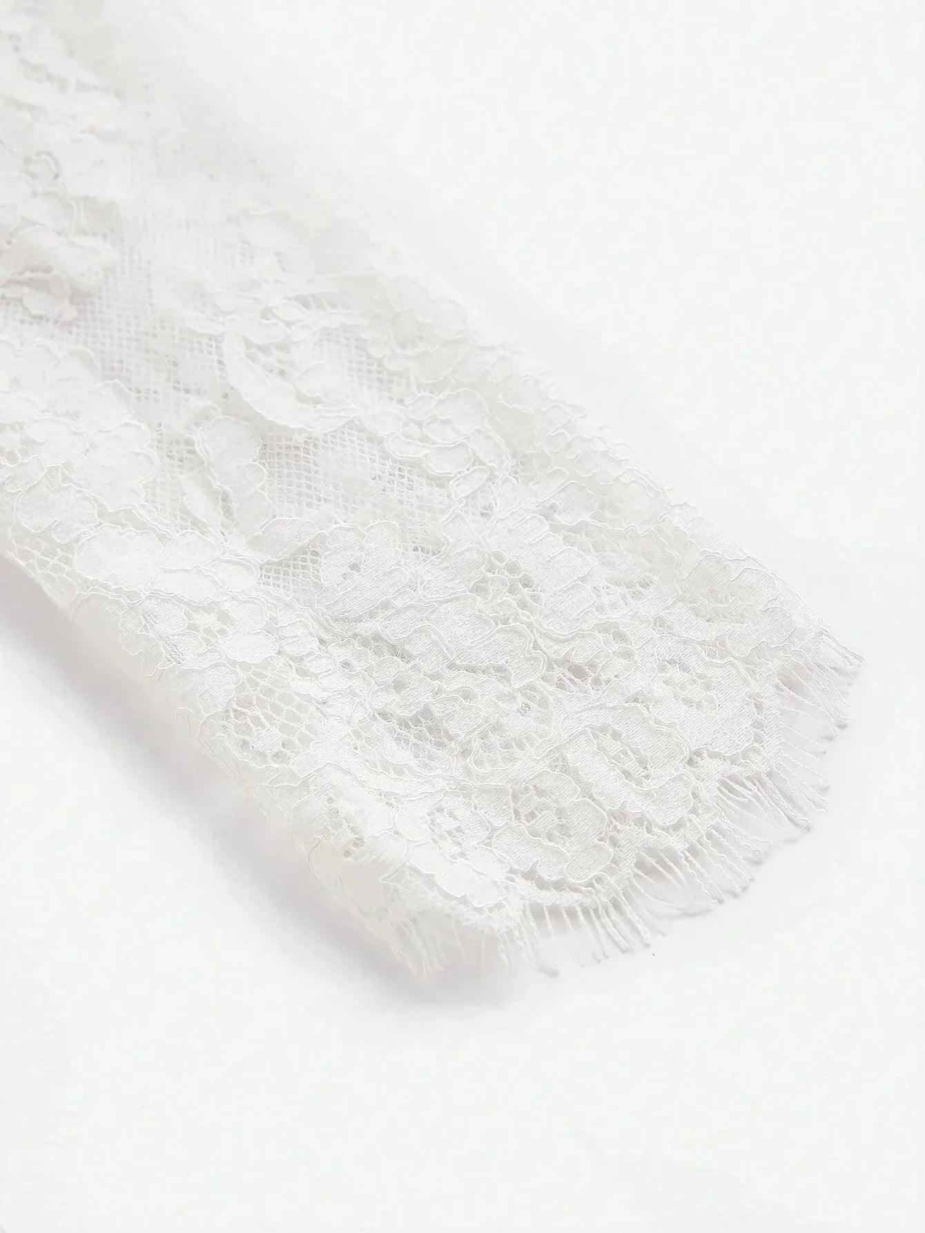 Delicate and romantic, this white lace dress features intricate floral patterns and a soft, flowing fit that adds elegance.
