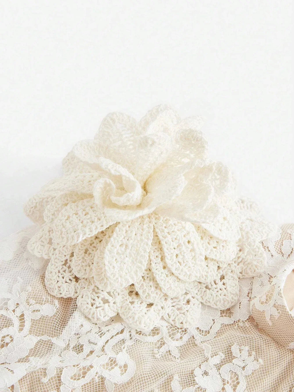 Delicate and feminine, this cream-colored lace dress features intricate floral patterns that evoke a vintage charm. The.