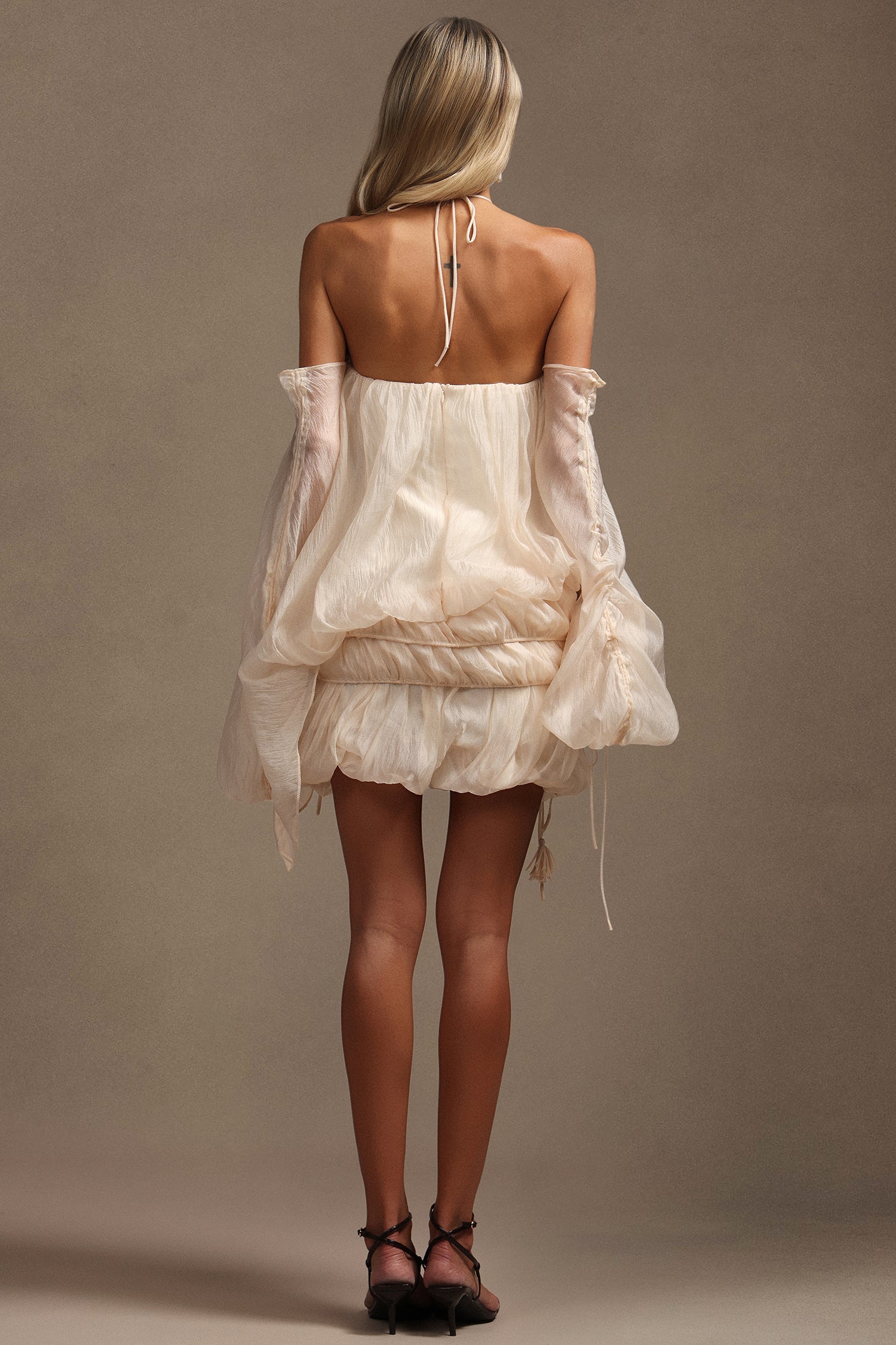 Hanna Beige Mini Dress Elegant Modern Silhouette Lightweight Fabric Waist Detailing Summer Parties Weddings Evenings Out Charm Style Versatile Heels Sandals Wardrobe