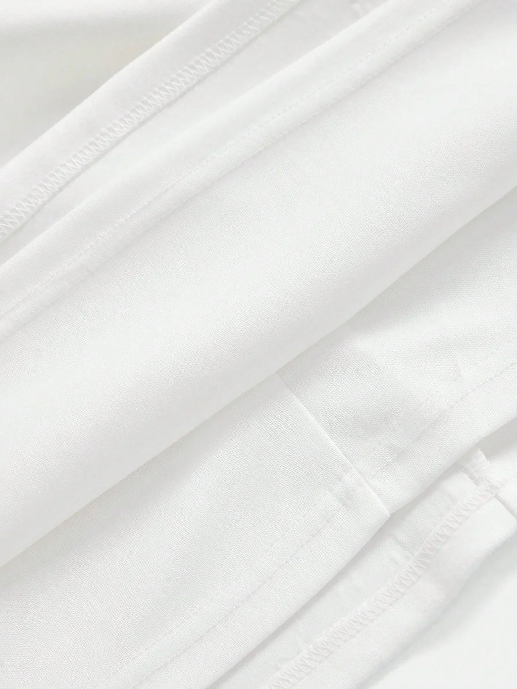 This elegant white dress features a sleek, form-fitting silhouette crafted from soft, breathable fabric, perfect for both.