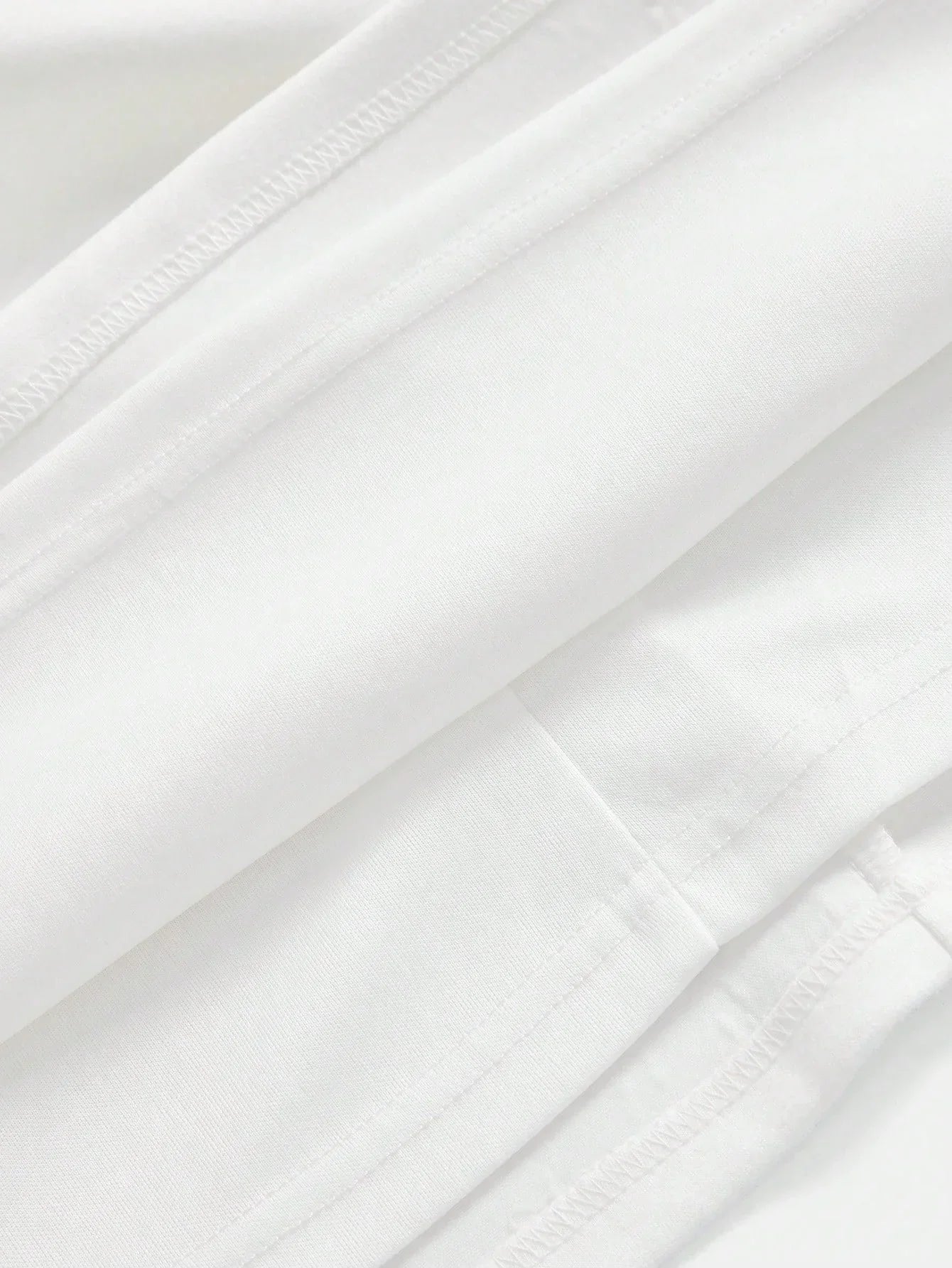This elegant white dress features a sleek, form-fitting silhouette crafted from soft, breathable fabric, perfect for both.