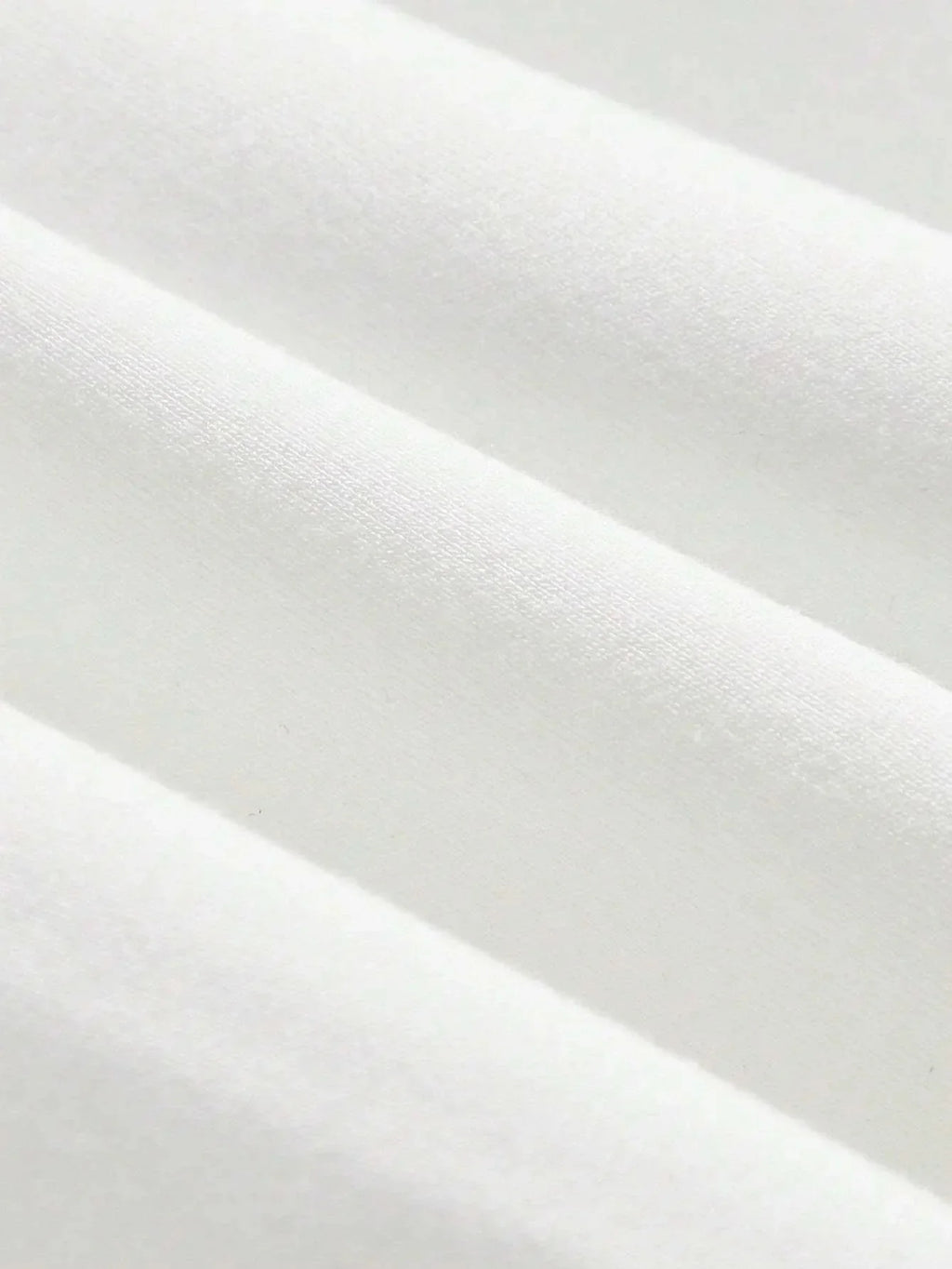 A soft, luxurious white dress crafted from a breathable cotton blend features a flattering fitted silhouette that gently.