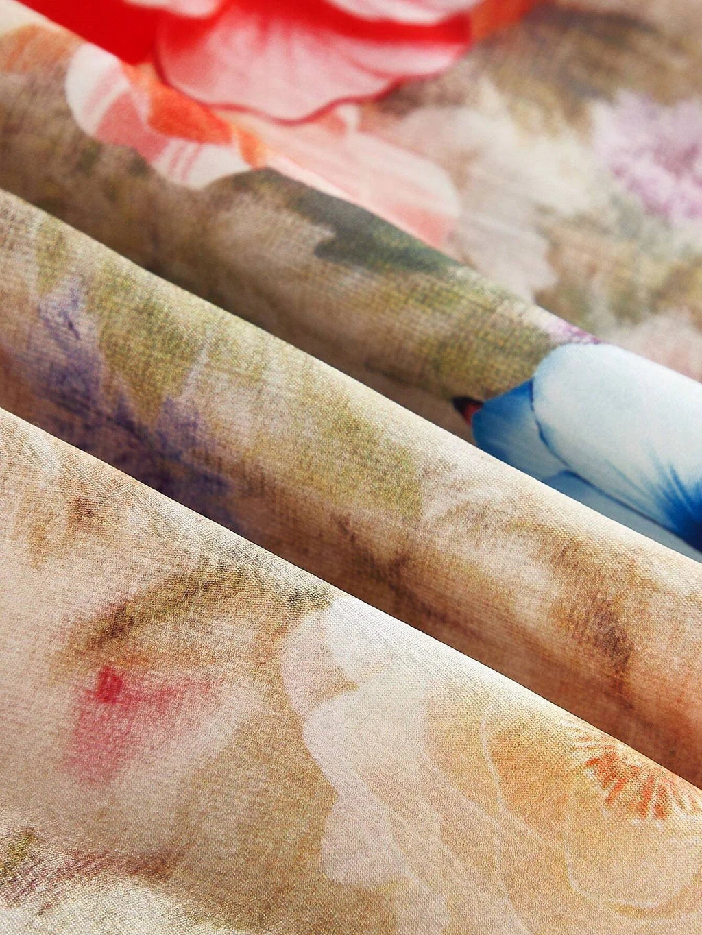 Discover the elegance of this floral-patterned dress, featuring a soft blend of pastel hues with vibrant blooms that evoke a.
