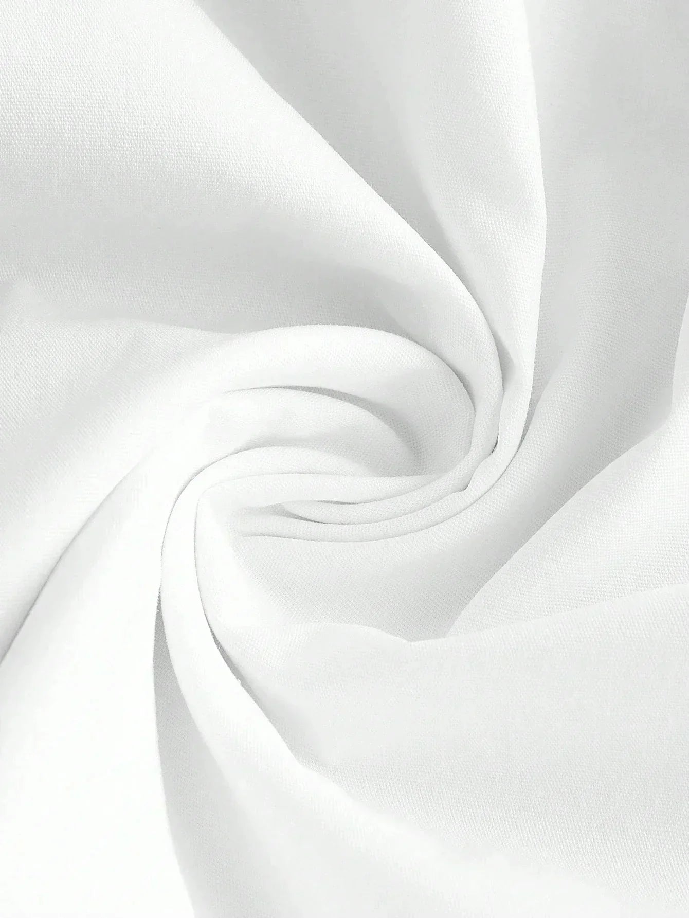 Soft and breathable white fabric spirals gracefully, showcasing its smooth texture and versatility. Perfect for creating.