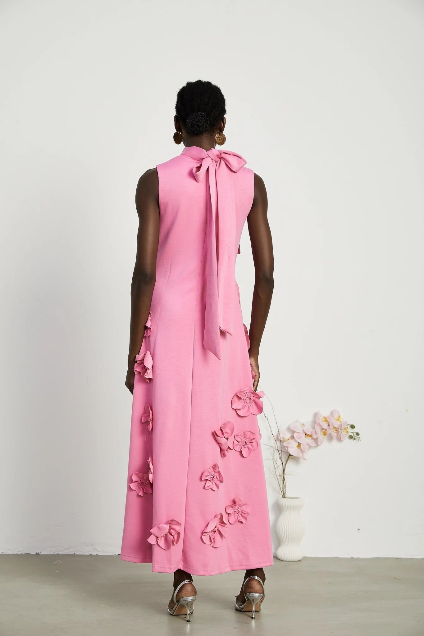 Lola Pink Maxi Dress with Faux - Flower Detail, Bow Neckline and Flounce Hem