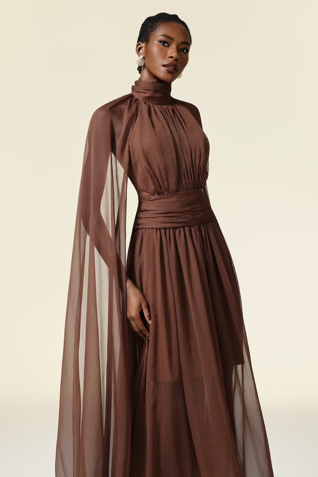 Mariangela Brown Maxi Dress High Neckline Elegant Silhouette Long Sleeves Formal Gatherings Lightweight Breathable Luxurious Texture Flattering Fit Confidence Poise
