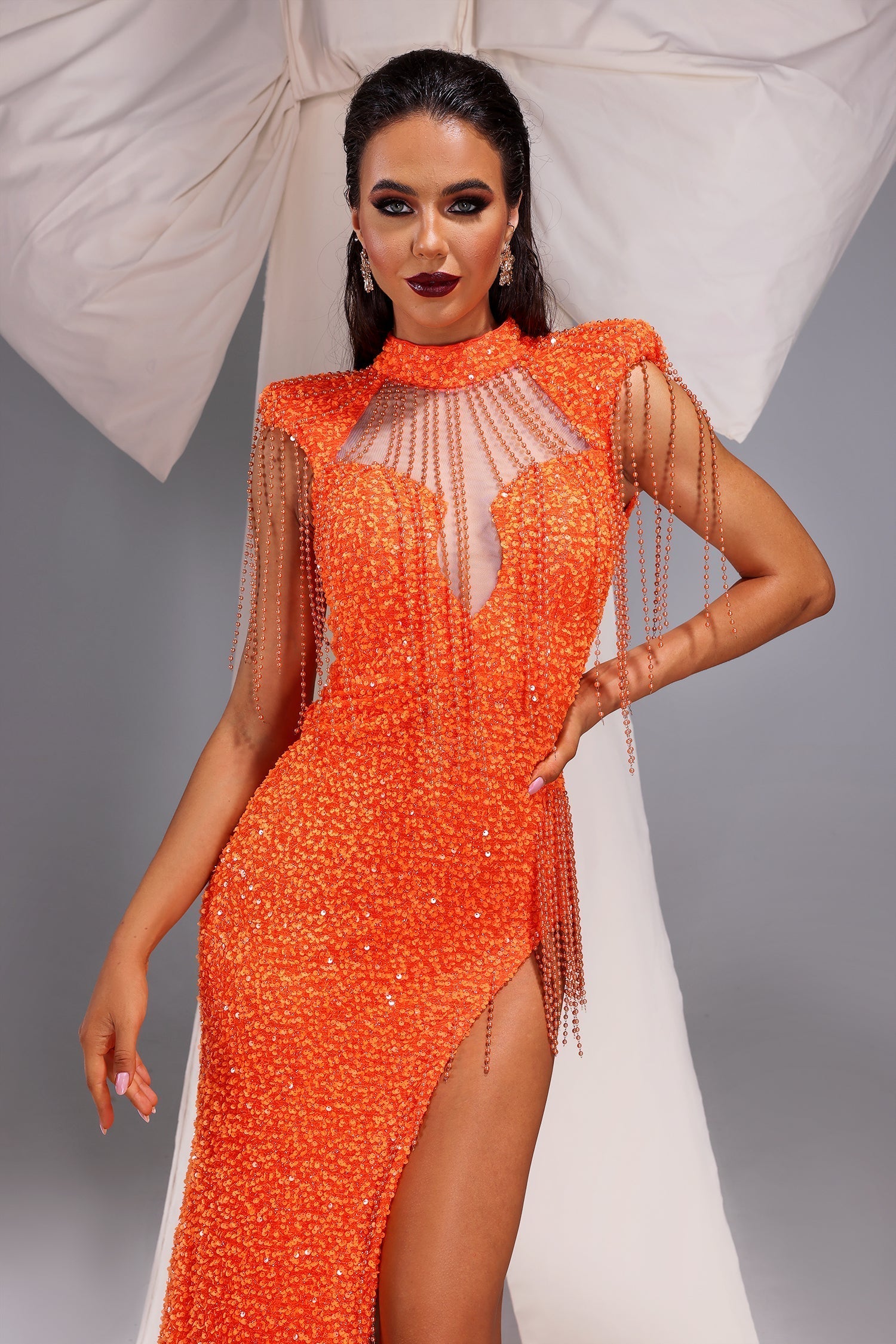 Mariangela Orange Sequin Maxi Dress with High Slit and Tassel Accents