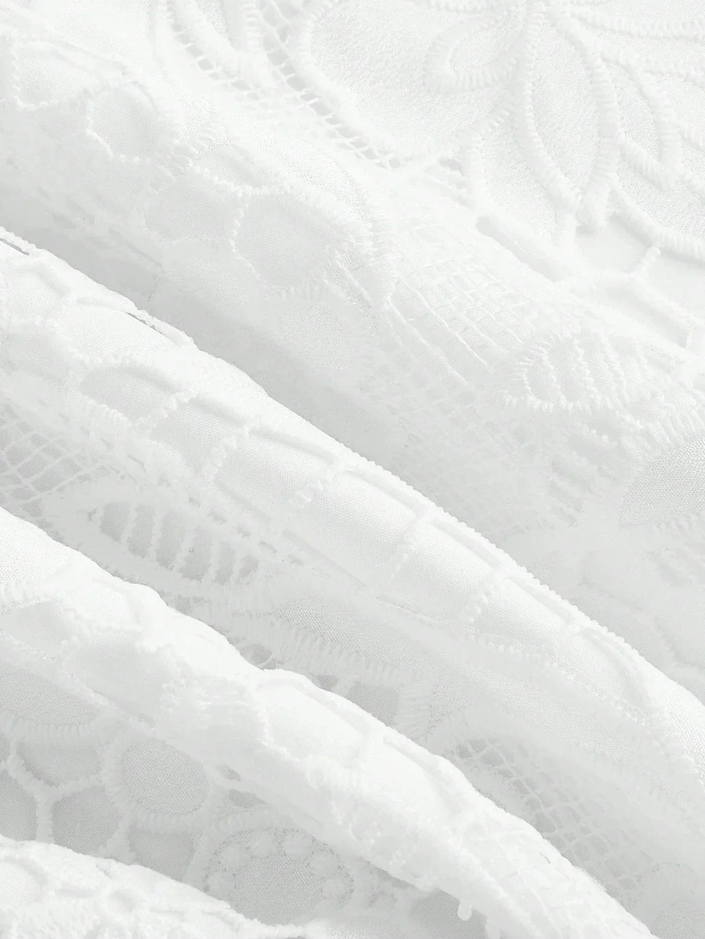 This elegant white dress features intricate lace detailing that adds a romantic touch, making it perfect for special.
