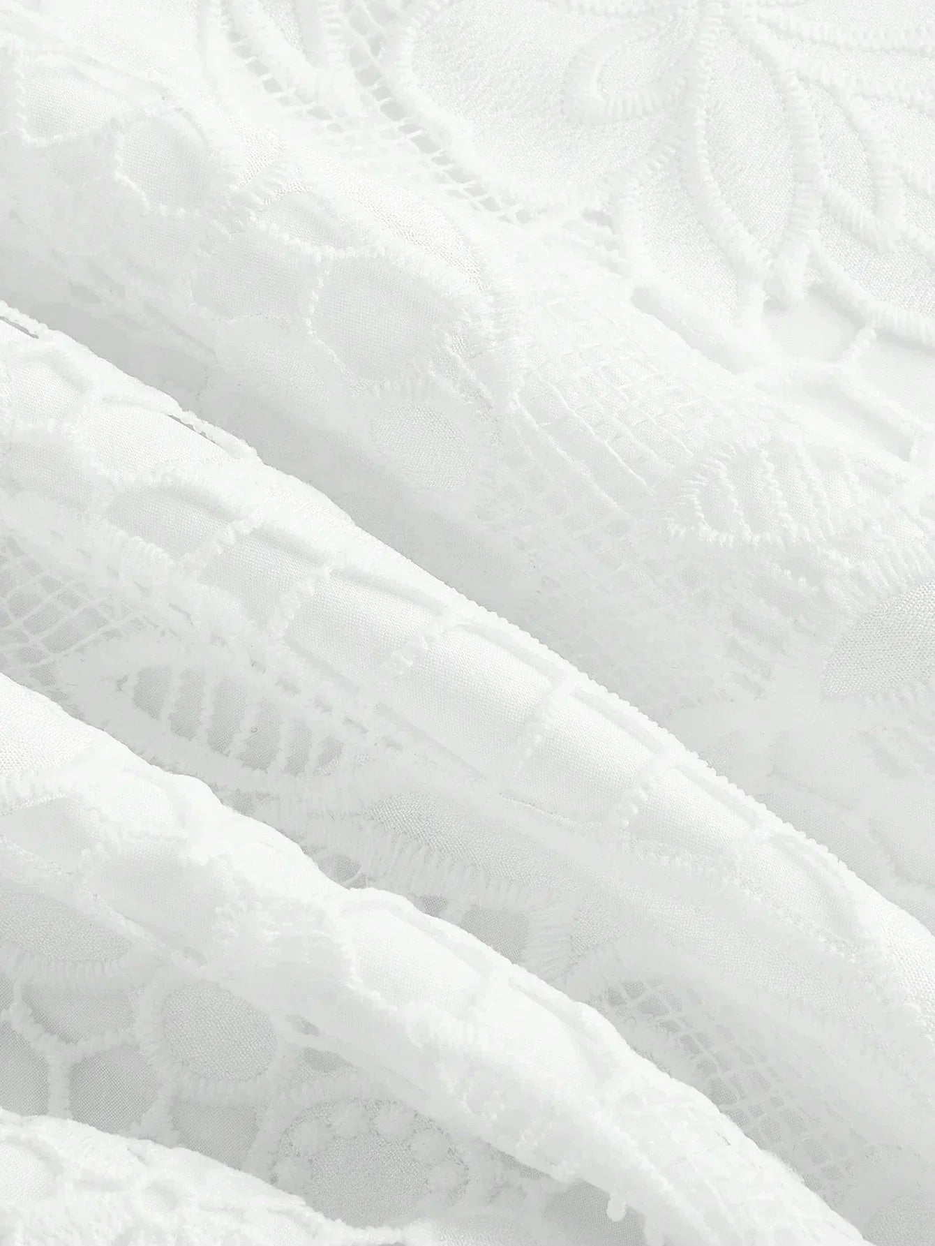This elegant white dress features intricate lace detailing that adds a romantic touch, making it perfect for special.