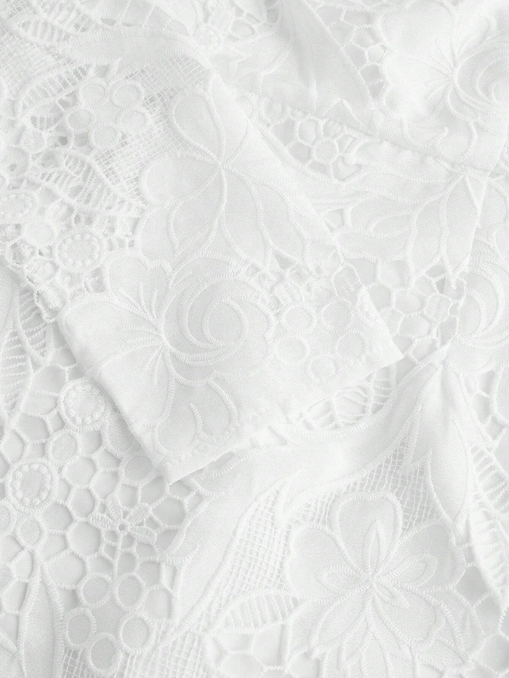 Delicate and elegant, this white lace dress features intricate floral patterns and a soft, flowing silhouette that enhances.
