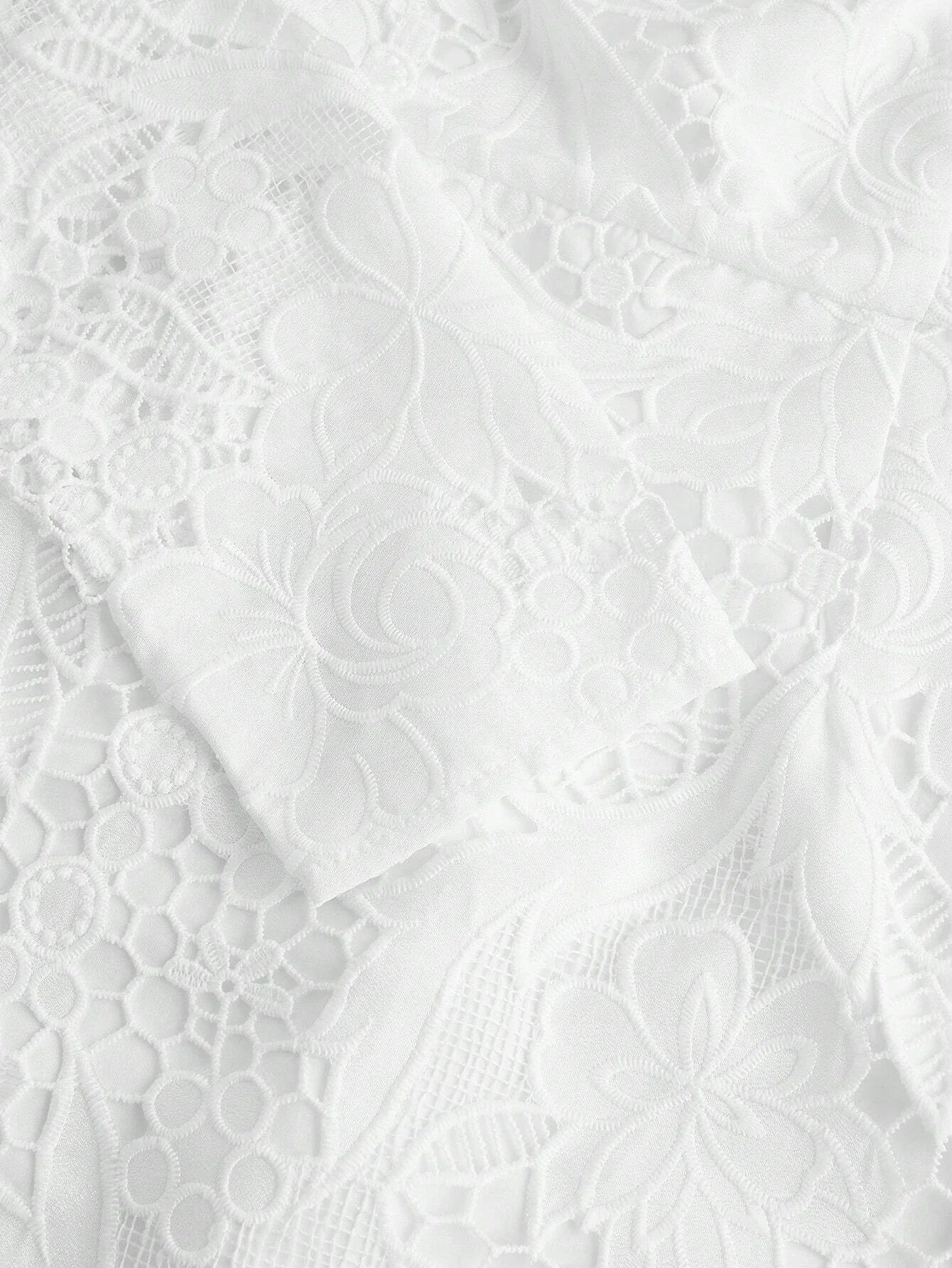 Delicate and elegant, this white lace dress features intricate floral patterns and a soft, flowing silhouette that enhances.