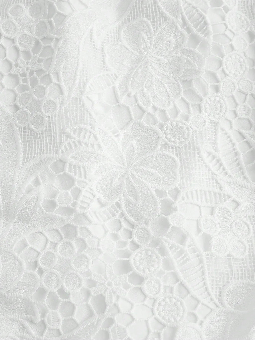 Delicate and elegant, this white lace dress features a beautifully intricate floral pattern that adds a touch of romance..