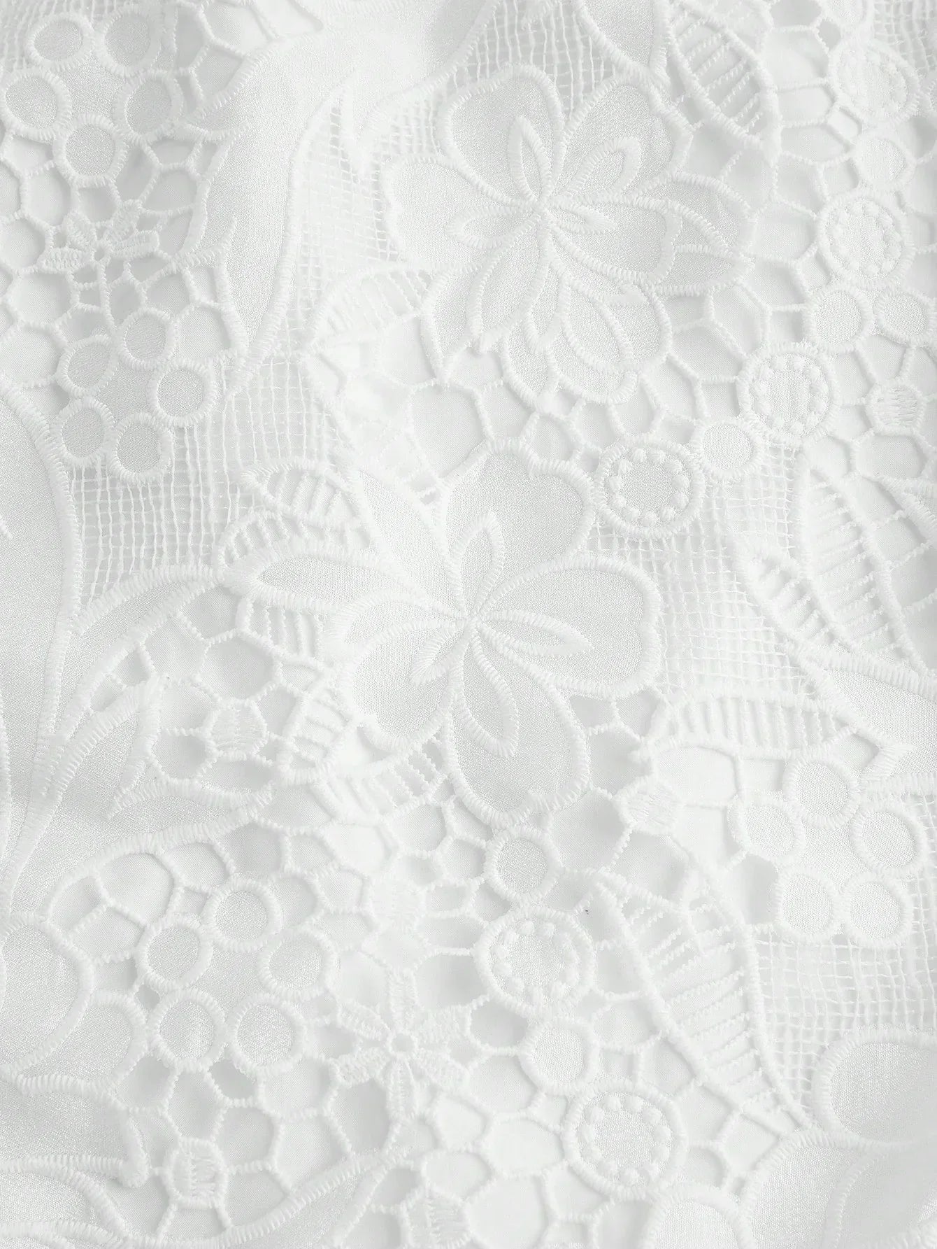 Delicate and elegant, this white lace dress features a beautifully intricate floral pattern that adds a touch of romance..