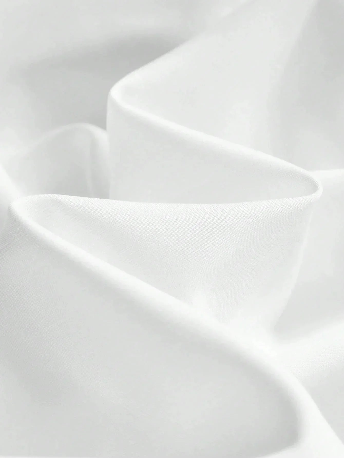 Experience elegance with this flowing white dress, crafted from a soft, lightweight fabric that drapes beautifully for a.