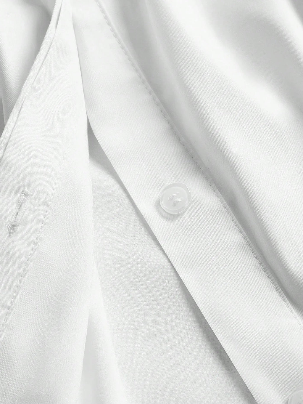 This elegant white dress features a sleek button-up design, showcasing a refined and polished look perfect for various.