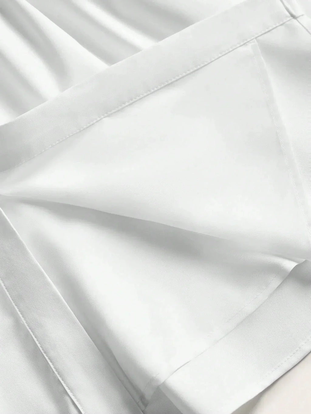 Experience elegance with this stunning white dress, featuring a sleek fit and a flowing silhouette. Made from a soft,.