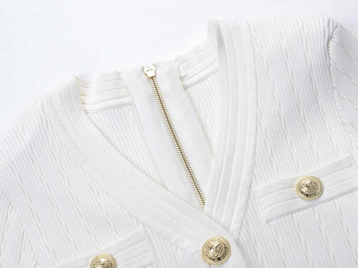 Roselia Top – Fitted Ribbed Knit – Short Sleeves – Gold Button Detail – Front Pockets – Tailored Silhouette – Textured Fabric