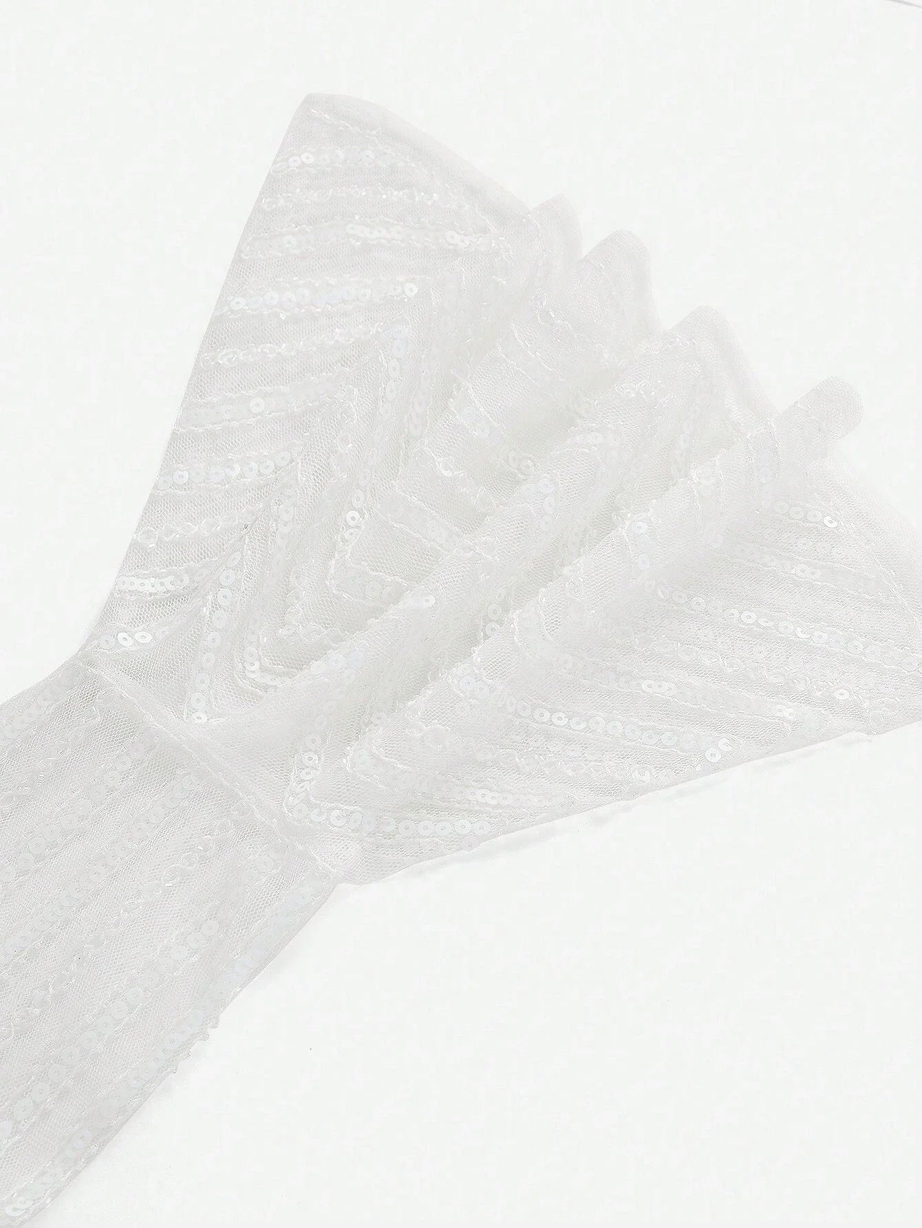 Delicate and enchanting, this white dress features shimmering sequins that catch the light beautifully, creating a.